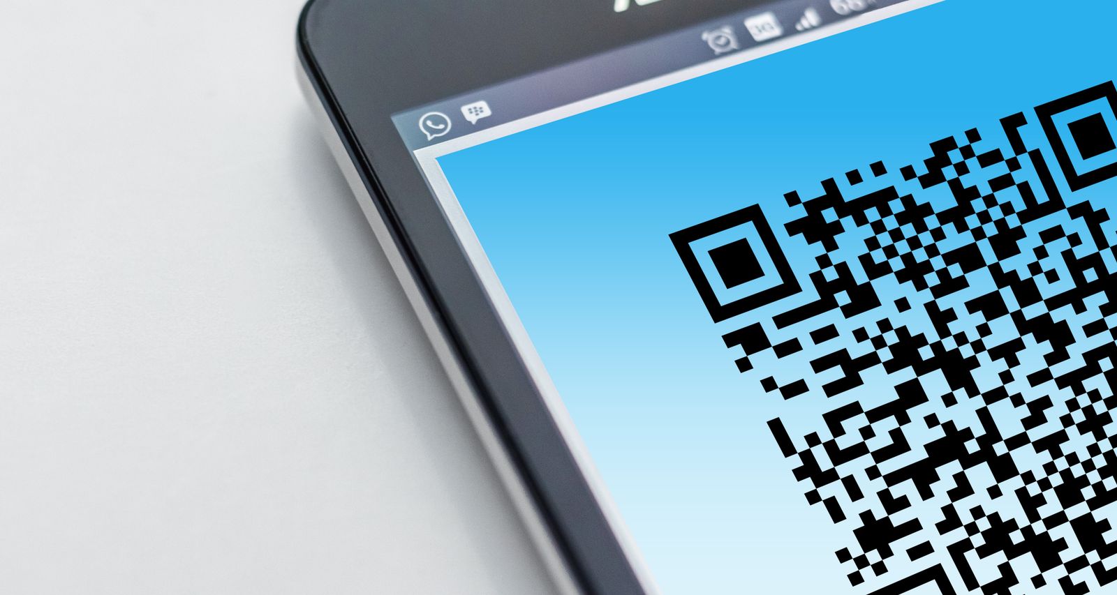 Close-up of a smartphone screen showing a QR code